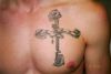 cross tats on chest